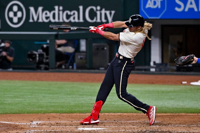 Jul 21, 2023; Arlington, Texas, USA; Texas Rangers left fielder Travis Jankowski (16) drives in a run against the Los Angeles Dodgers during the fourth inning at Globe Life Field. Mandatory Credit: Jerome Miron-USA TODAY Sports